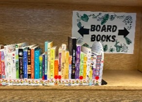 Board books displayed on a shelf.